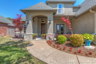 Attractive curb appeal with stucco and stone accen