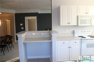 Open feel from kitchen area to living / dining are
