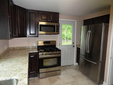 Kitchen. Kitchen has a back door to the flat backy