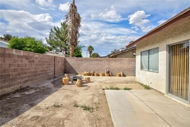 View of yard with a patio, a fenced backyard, and