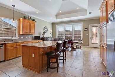 Spacious kitchen with vaulted ceilings and an isla