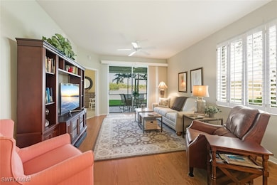 Living area featuring light wood-type flooring and a ceiling fan