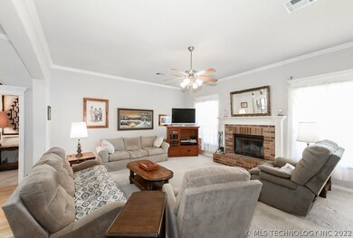 Living room with brick fireplace.