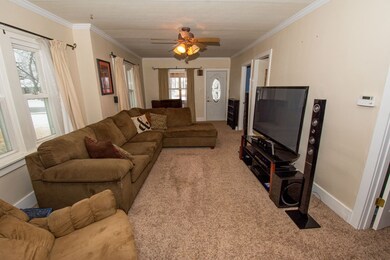 Large living room with newer carpet.