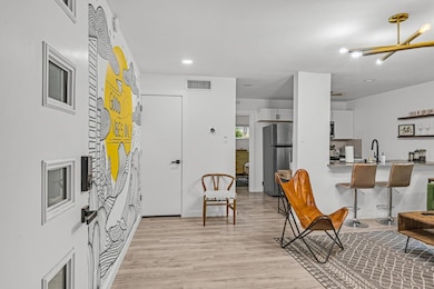 Foyer entrance featuring visible vents, recessed 