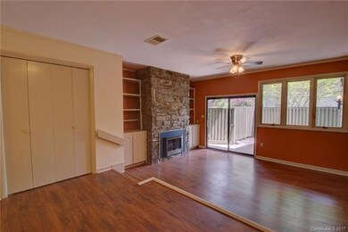 Living area with built-ins opens to private patio