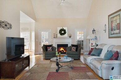 Boasts volume ceilings, hardwoods & marble firepla