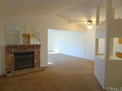 OPEN LIVING ROOM/KITCHEN WITH COZY FIREPLACE