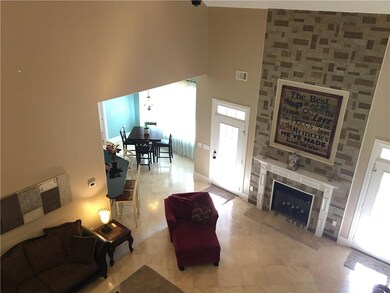 Another View of fireplace from top of open stairca