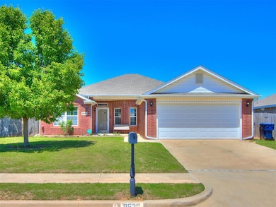 View of front of property with concrete driveway, a garage, brick siding, and roof with shingles