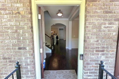 Front entrance featuring brick facia