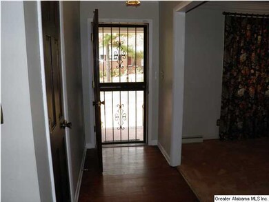 Hardwood flooring and coat closet in the entrance 