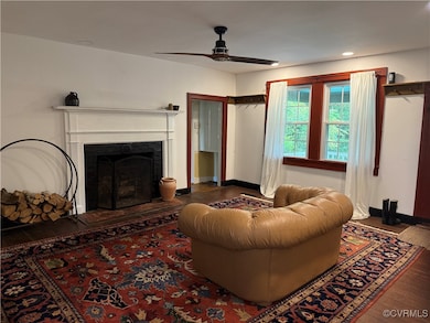 Living area featuring wood-type flooring, a ceilin