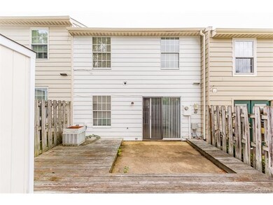 Fenced in back with storage shed
