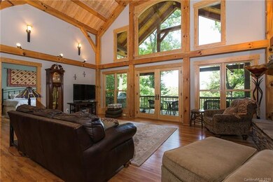 Living room view through covered back porch to mou