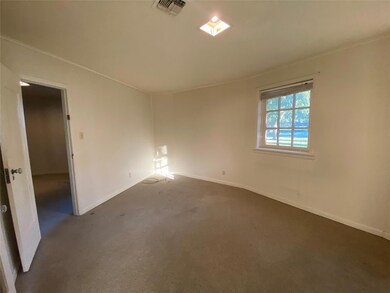 Spare room with dark carpet