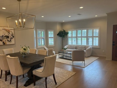 Dining space featuring ornamental molding, healthy