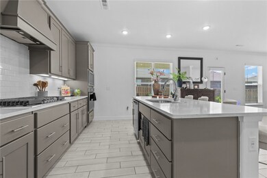 Grey cabinets with bar style pull hardware and whi