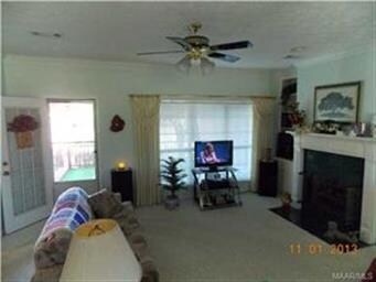 Family room. Gas logs. Door to patio. View of the 