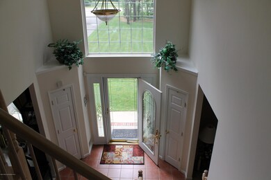 Foyer with Pella door with sidelights