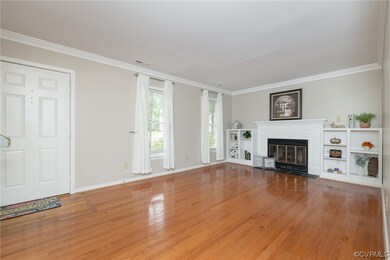 Living room featuring hardwood flooring, gas Firep