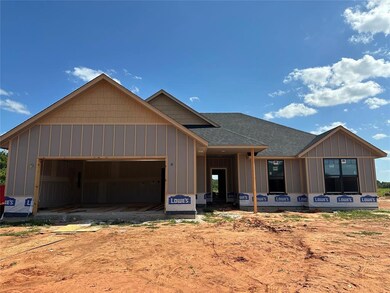 View of front of home featuring a garage