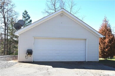 Detached garage has HVAC, 1/2 bath and pull down stairs for even more storage!