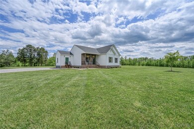 View of front of house featuring a front lawn and