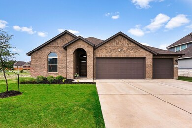 View of front facade with brick siding, an attach