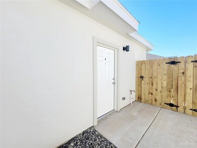 View of exterior entry with stucco siding