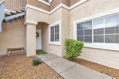 Entrance to property featuring stucco siding