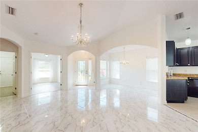 Grand vaulted ceilings, formal entry, elegant arch