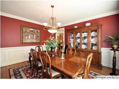 Spacious DR with crown molding, wainscoting and ha