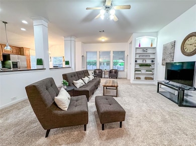 Living area with decorative columns, light colore