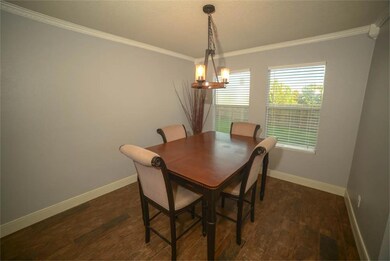Open to the living room you ll find this nice dining area.