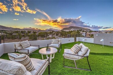 Patio terrace at dusk featuring a mountain view an