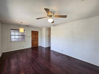 Spare room with wood finished floors, a ceiling f