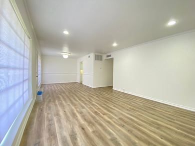 Another view of the spacious living room and dinin