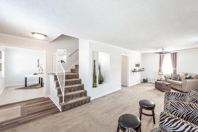 Upon entering the home to the right is a spacious living room, that wraps around to the kitchen from both ends of the room. A very clean pallet for you to decorate with your own unique designs.