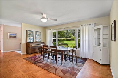The dining room features a huge window for more great light and the same original oak parquet floors as the living area and bedrooms!