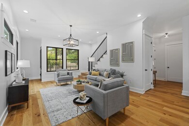 Living room with a chandelier, light wood-type fl