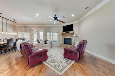 Open-concept living, dining, and kitchen.