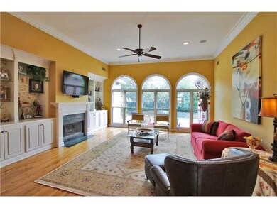 Large room with floor-to-ceiling windows overlooki