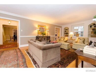 Elegant Living Room w/arched, illuminated built-in