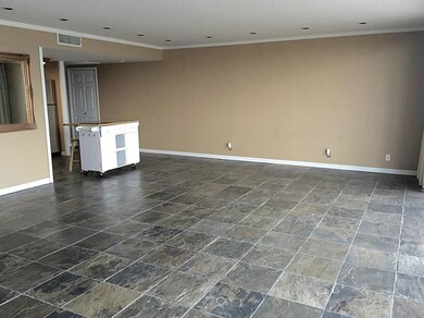 View toward entry and kitchen