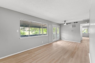 Spare room featuring wood finished floors, a ceil