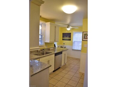 Sunny kitchen with granite counter tops, extra lar