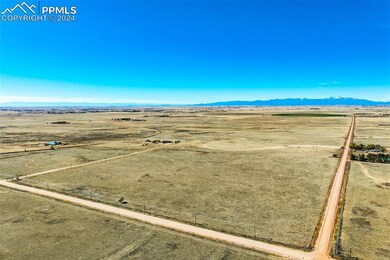 Birds eye view of property with a mountain view an