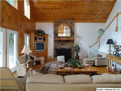 Open floor plan great room with stone faced firepl