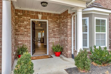 Spacious front porch, no steps into the home.